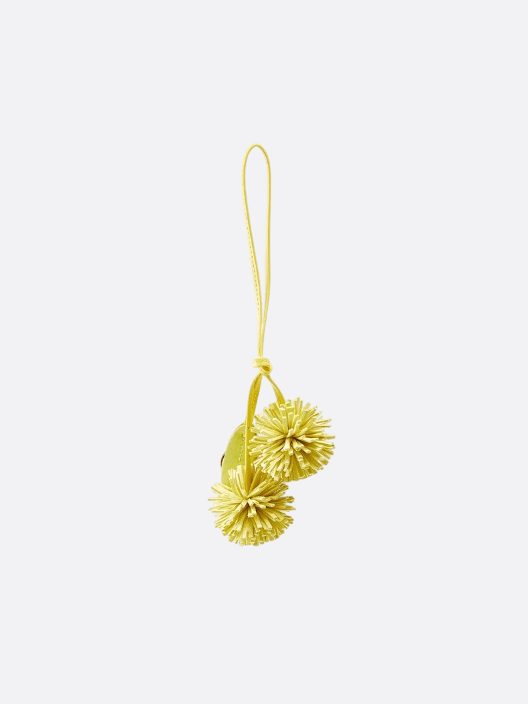 Bijou de sac pompon cuir jaune