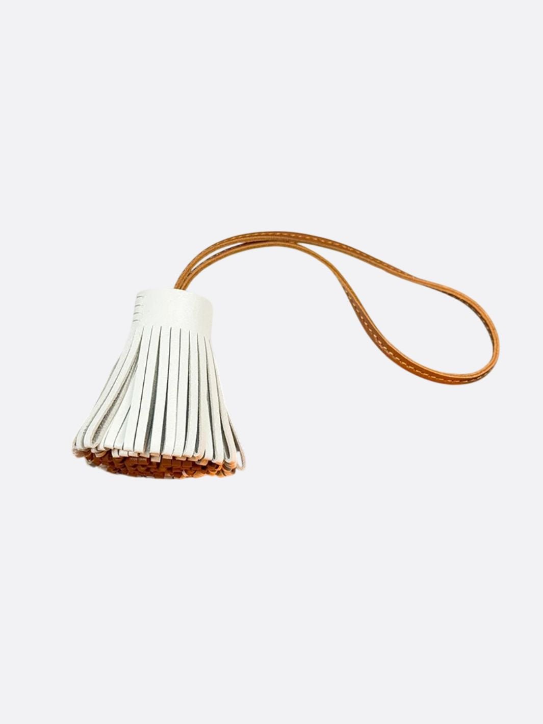 pompon cuir blanc et rouge