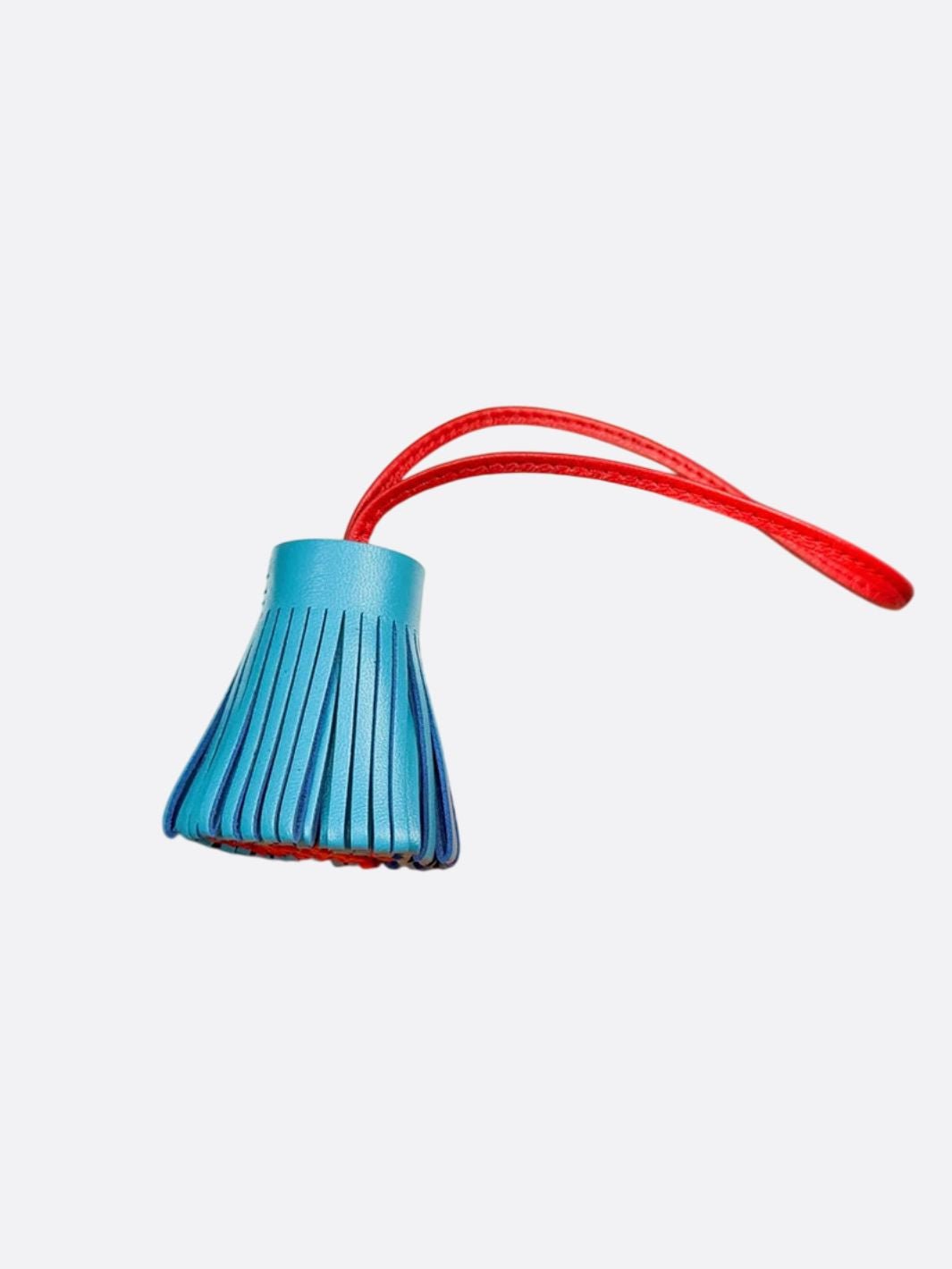 pompon cuir bleu et rouge